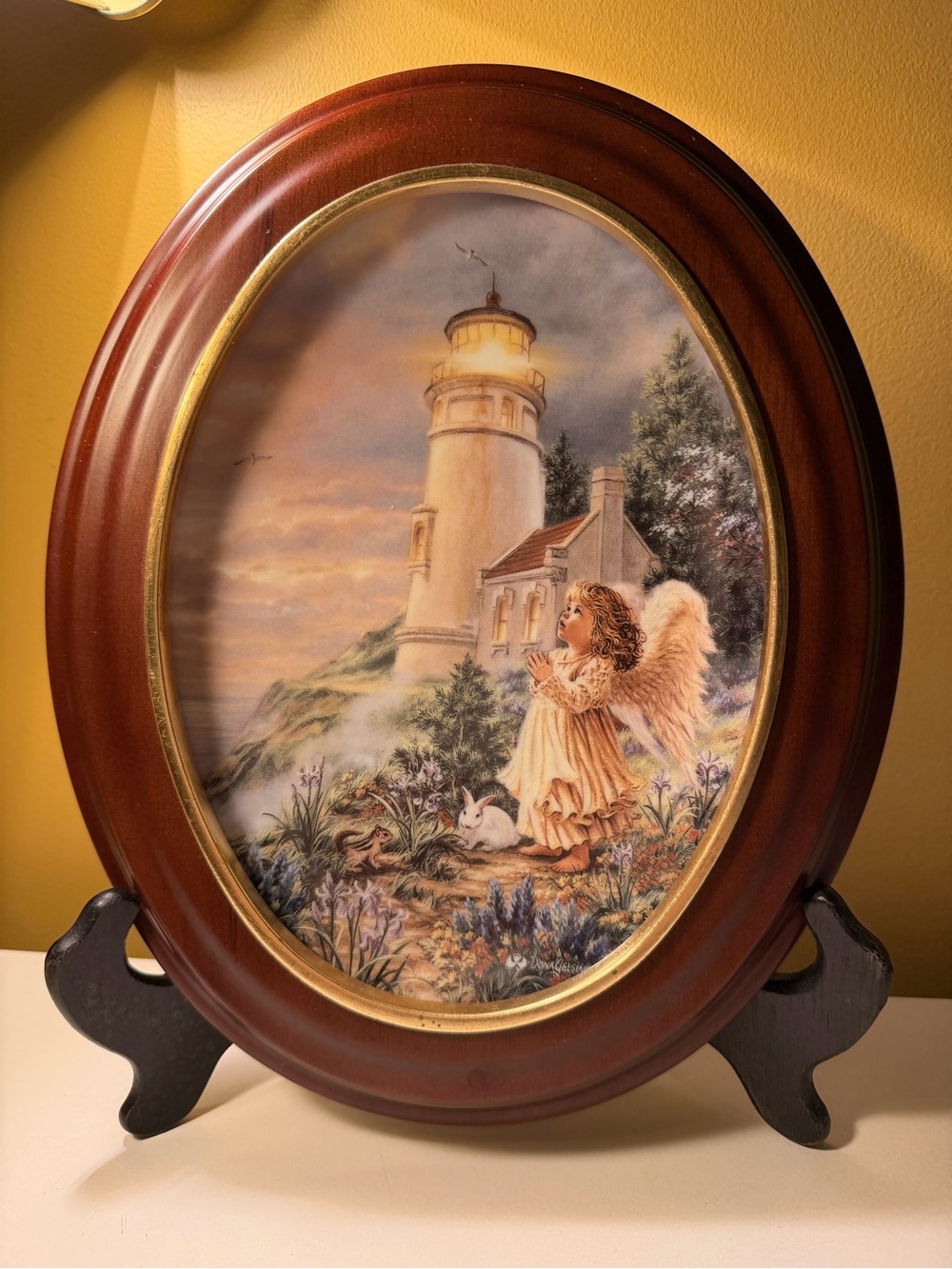 Lighthouse & Angel framed oval. Excellent condition. One owner.